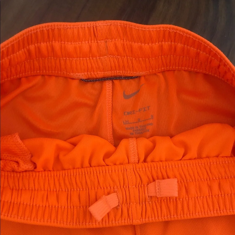 Nike boys Bright Orange Athletic Shorts with Reflective Logo
